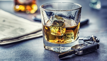 car keys and beverage on table