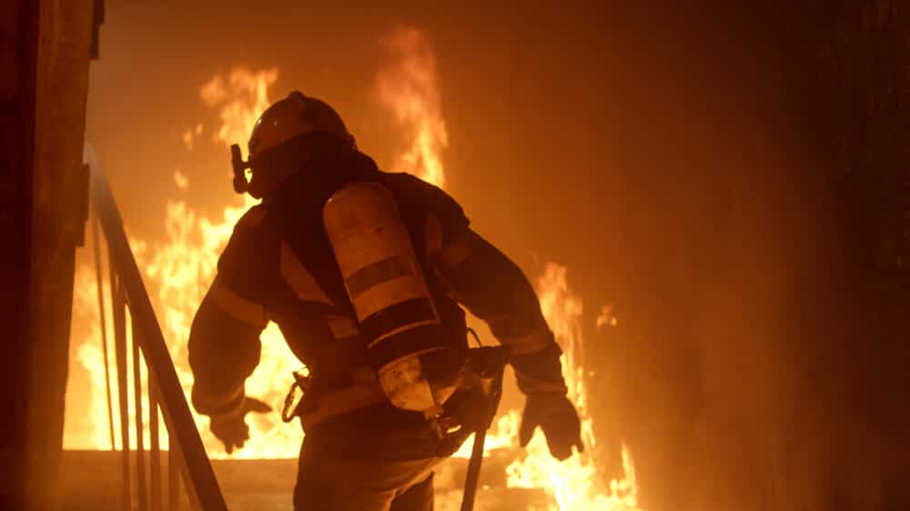 Firefighter Running Through Fire